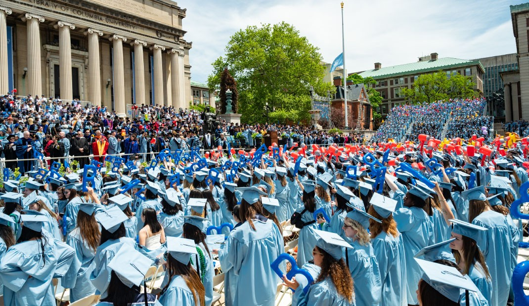 college graduation and students in university celebrate